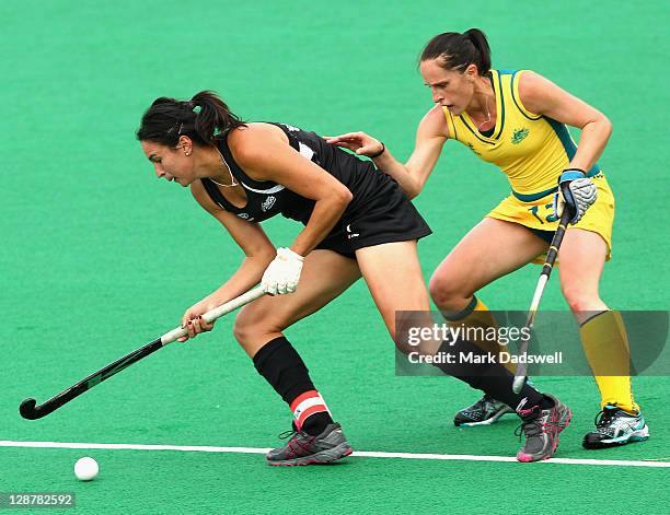 Madonna Blyth of the Hockeyroos competes with Kayla Sharland of the Blacksticks during the Oceania Cup match between New Zealand and Australia at...