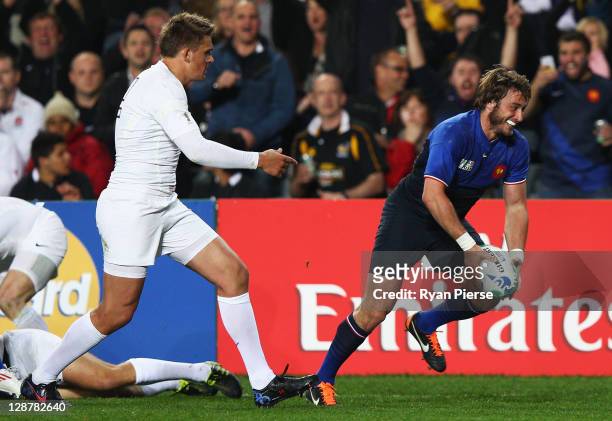Maxime Medard of France goes over to score his teams second try during quarter final two of the 2011 IRB Rugby World Cup between England and France...