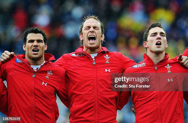 Mike Phillips, Alun Wyn Jones and George North sing their national anthem ahead of the quarter final one of the 2011 IRB Rugby World Cup between...