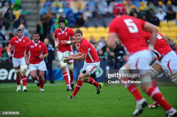 Rhys Priestland of Wales looks to dispatch the pass during quarter final one of the 2011 IRB Rugby World Cup between Ireland v Wales at Wellington...