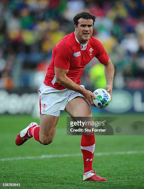 Jamie Roberts of Wales runs with the ball during quarter final one of the 2011 IRB Rugby World Cup between Ireland v Wales at Wellington Regional...