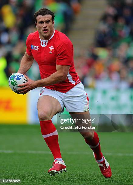 Jamie Roberts of Wales runs with the ball during quarter final one of the 2011 IRB Rugby World Cup between Ireland v Wales at Wellington Regional...
