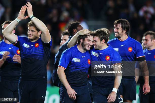 Maxime Medard C) Vincent Clerc of France celebrate victory after the quarter final two of the 2011 IRB Rugby World Cup between England and France at...