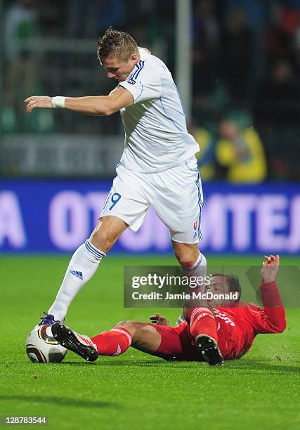 Juraj Kucka of Slovakia battles with Roman Sirokov of Russia during the EURO 2012, Group B qualifier between Slovakia and Russia at the MSK Zilina...