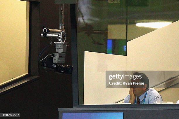 Martin Johnson, manager of England covers his face during quarter final two of the 2011 IRB Rugby World Cup between England and France at Eden Park...