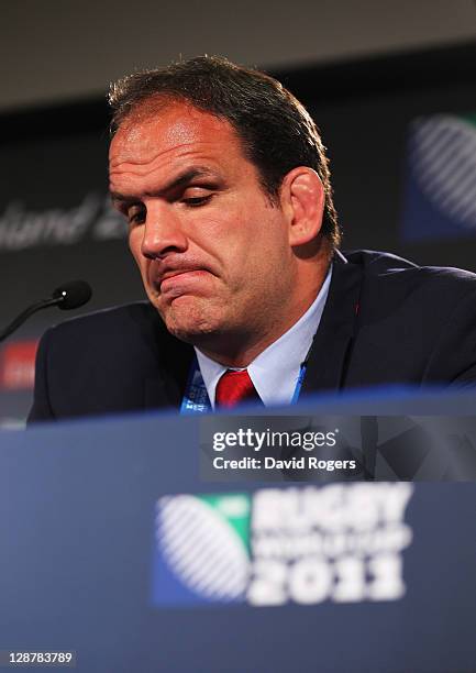 Martin Johnson, manager of England looks dejected in a press conference after quarter final two of the 2011 IRB Rugby World Cup between England and...