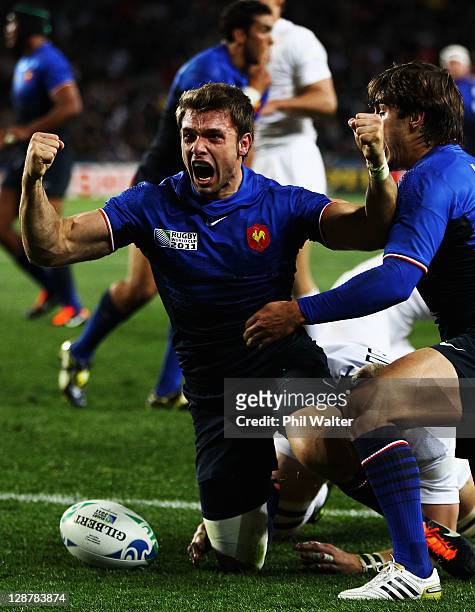 Vincent Clerc of France celebrates his opening try with Alexis Palisson during quarter final two of the 2011 IRB Rugby World Cup between England and...