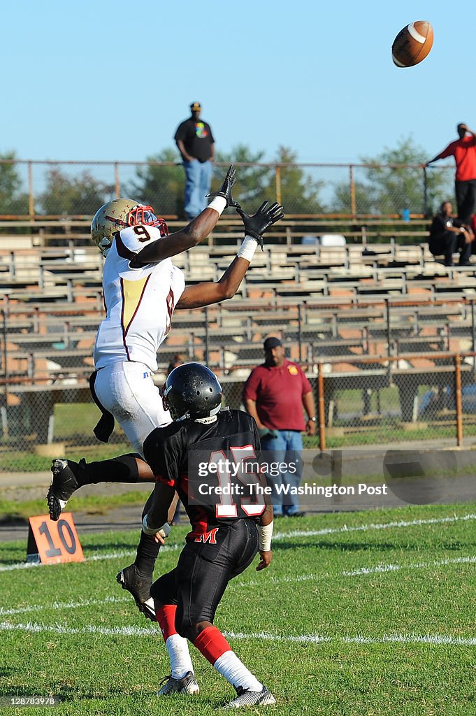 Douglass WR Paul Harris leaps for a touchdown pass over Crossland