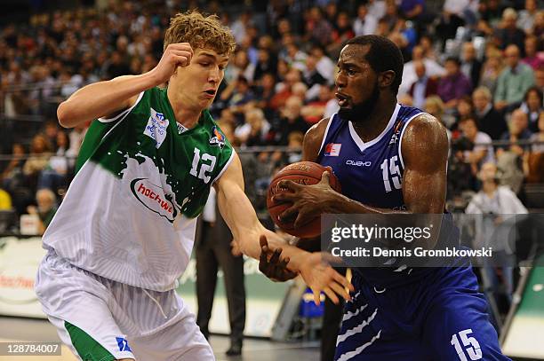 Andreas Seiferth of Trier challenges Zachery Peacock of Bremerhaven during the BEKO BBL Bundesliga match between TBB Trier and Eisbaeren Bremerhaven...