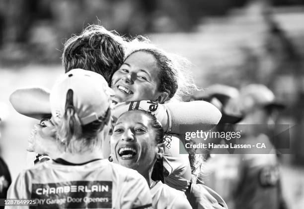 Player of the match Hannah Darlington of Thunder celebrates with team during the Women's Big Bash League WBBL Semi Final match between the Brisbane...