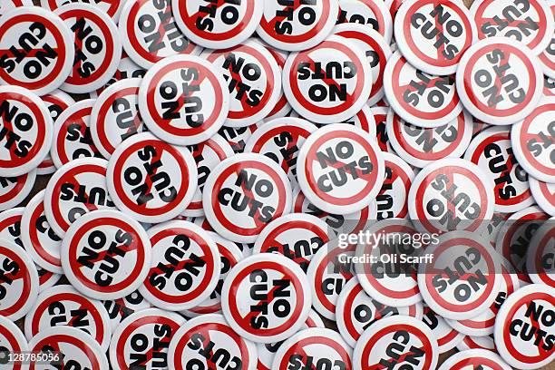 Anti-cuts pin badges on sale at the 'Anti-war Mass Assembly' organised by the Stop the War Coalition in Trafalgar Square on October 8, 2011 in...