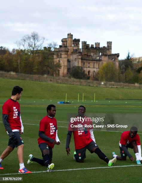 Celtic players Miku, Efe Ambrose, Victor Wanyama and Rabiu Ibrahim limber up ahead of training.