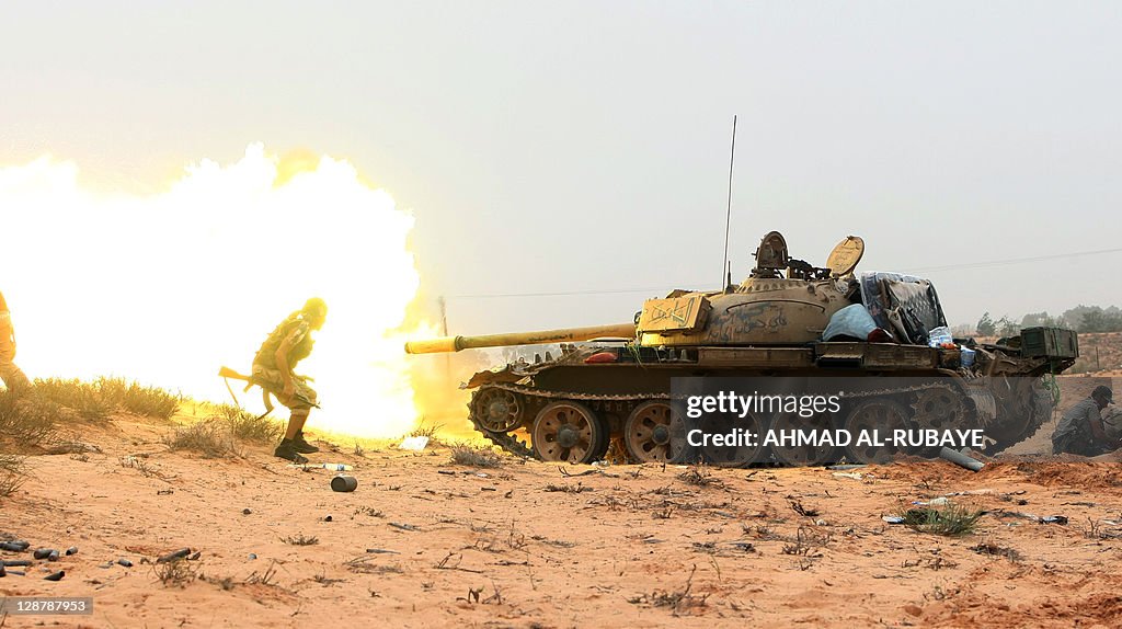 A tank is fired as Libyan fighters loyal