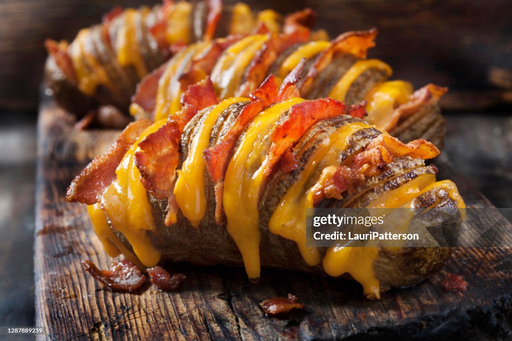 Cheesy, Hasselback Potatoes Stuffed with Cheddar and Bacon