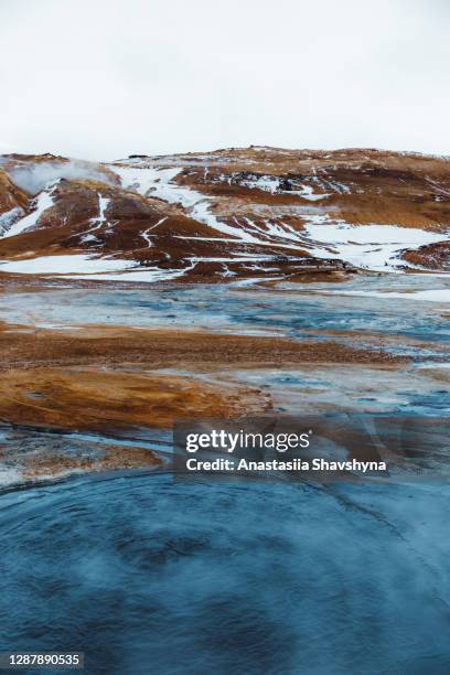 scenic view of hverir hot spring valley in snow in north iceland - myvatn stock pictures, royalty-free photos & images