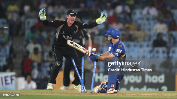 Mumbai Indian batsman, Aiden Blizzard, being bowled by Somerset bowler Murali Kartik as wicket keeper Craig Kieswetter celebrates during the...