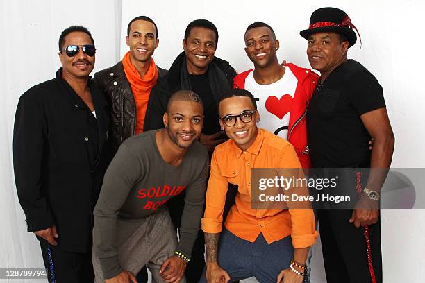 Marlon Jackson, Marvin Humes, JB Gill, Jackie Jackson, Aston Merrygold, OritsT Williams and Tito Jackson pose for a portrait backstage at the...
