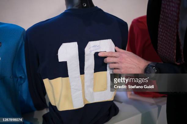 Diego Armando Maradona football shirts with autograph for auction preparation during the preparation of the "Sport Memorabilia" auction on November...