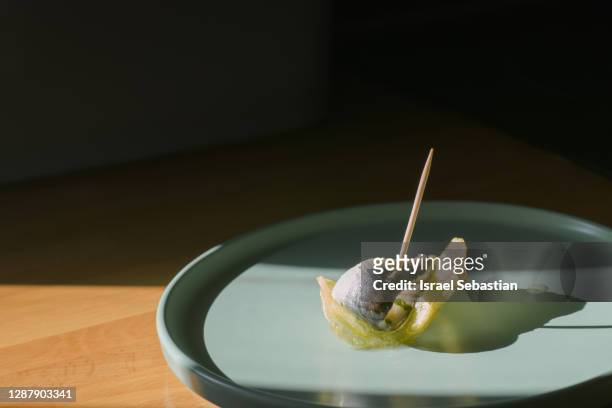 close-up of a chips with an anchovy in vinegar - protein bar fotografías e imágenes de stock