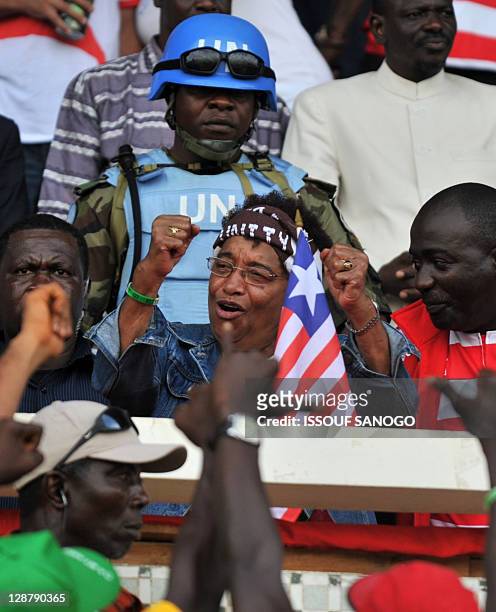 Liberia's President Ellen Johnson Sirleaf and Nobel Peace Prize 2011 winner greets supporters on October 8,2011 at the Samuel K.Doh stadium in...