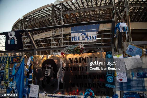 Plate naming unofficially the San Paolo stadium after the soccer player Diego Armando Maradona is seen among other tributes on the fences during the...