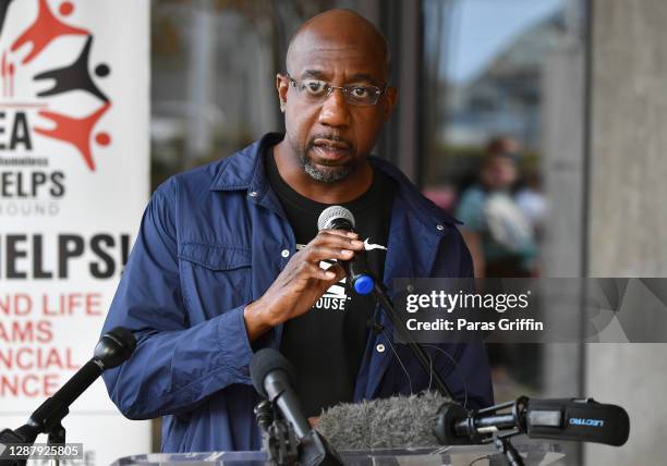 Raphael Warnock speaks onstage during Hosea Helps Thanksgiving Dinner Drive Thru at Georgia World Congress Center on November 26, 2020 in Atlanta,...