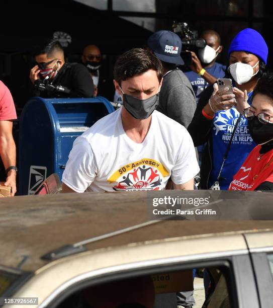 Jon Ossoff delivers food goods during Hosea Helps Thanksgiving Dinner Drive Thru at Georgia World Congress Center on November 26, 2020 in Atlanta,...