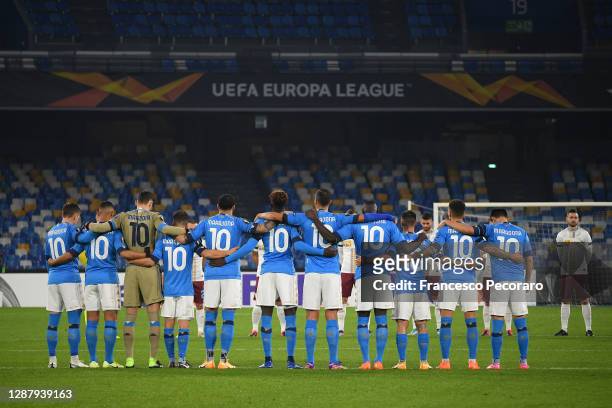 Players and Officials observe a minute of silence wearing number 10 on their shirts prior to kick off in memory of Diego Maradona while wearing a...