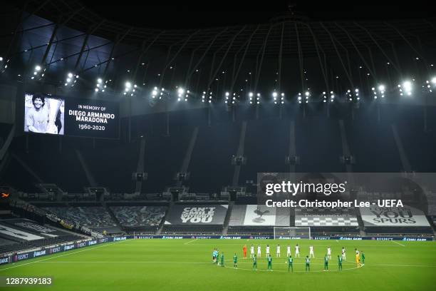 Players and Officials observe a minute of silence prior to kick off in memory of Diego Maradona during the UEFA Europa League Group J stage match...