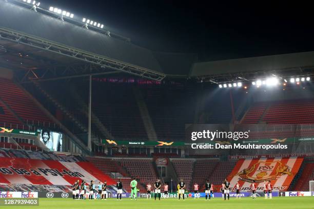Players and Officials observe a minute of silence prior to kick off in memory of Diego Maradona during the UEFA Europa League Group E stage match...
