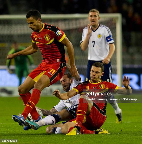 V SCOTLAND.KING BAUDOUIN STADIUM - BRUSSELS.Scotland striker Steven Fletcher is squeezed out by Nacer Chadli and Thomas Vermaelen