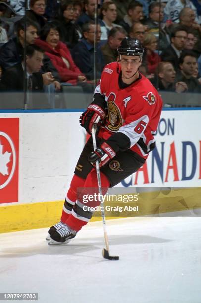 Wade Redden of the Ottawa Senators skates against the Toronto Maple Leafs during NHL game action on December 13, 1999 at Air Canada Centre in...