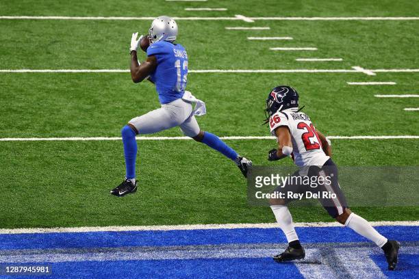 Mohamed Sanu of the Detroit Lions catches a pass for a touchdown in front of Vernon Hargreaves III of the Houston Texans during the second half of a...