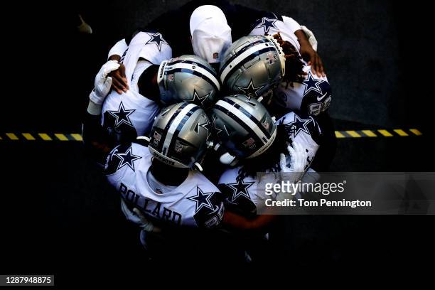 Ced Wilson, CeeDee Lamb, Tony Pollard, and Rico Dowdle of the Dallas Cowboys are seen prior to taking the field for a game against the Washington...