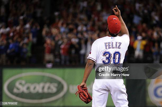 Neftali Feliz of the Texas Rangers celebrates after the final out of the Rangers the 3-2 win over the Detroit Tigers in Game One of the American...