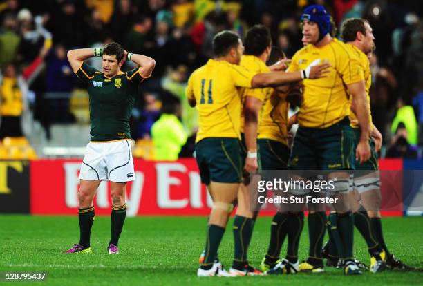 Morne Steyn of South Africa shows his dejection as the Wallabies celebrate after quarter final three of the 2011 IRB Rugby World Cup between South...