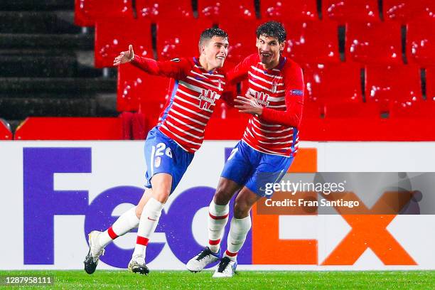 Alberto Soro of Granada celebrates with his team mate Jesús Vallejo after scoring his team's second goal during the UEFA Europa League Group E stage...