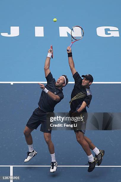 Robert Lindstedt of Sweden and Horia Tecau of Romania complete against Nenad Zimonjic of Serbia and Michael Llodra of France during the men's doubles...