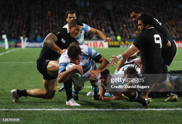 Julio Farias Cabello of Argentina goes over to score the opening try during quarter final four of the 2011 IRB Rugby World Cup between New Zealand...