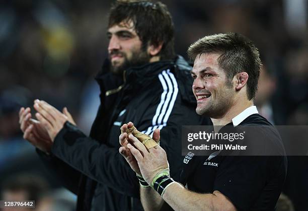 Richie McCaw of the All Blacks applauds his team with Sam Whitelock during quarter final four of the 2011 IRB Rugby World Cup between New Zealand and...