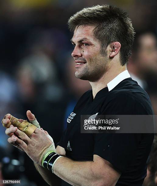 Richie McCaw of the All Blacks applauds his team during quarter final four of the 2011 IRB Rugby World Cup between New Zealand and Argentina at Eden...