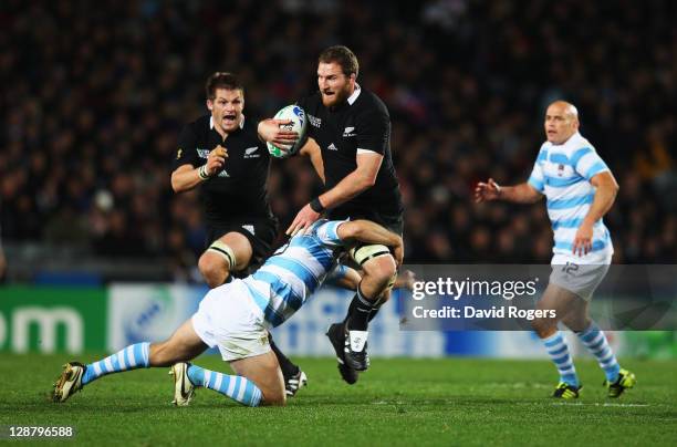 Kieran Read of the All Blacks is tackled by Marcelo Bosch of Argentina during quarter final four of the 2011 IRB Rugby World Cup between New Zealand...