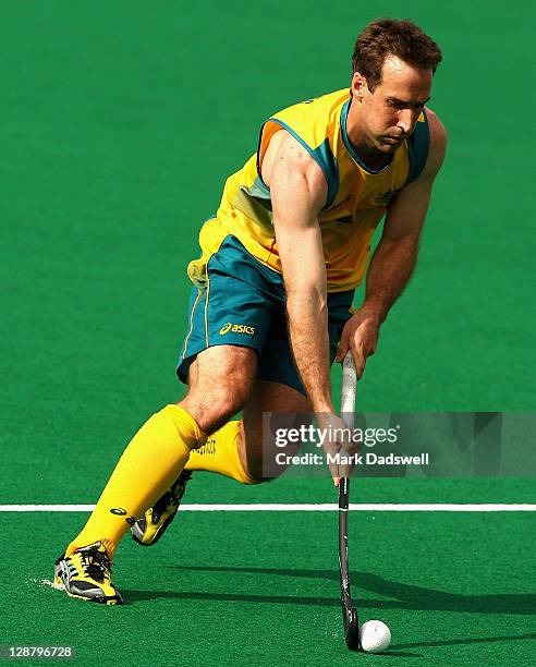 Fergus Kavanagh of the Kookaburras runs the ball downfield during the Oceania Cup match between New Zealand and Australia at Hobart Hockey Centre on...