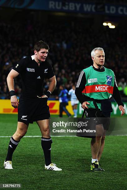 Colin Slade of the All Blacks leaves the field injured during quarter final four of the 2011 IRB Rugby World Cup between New Zealand and Argentina at...