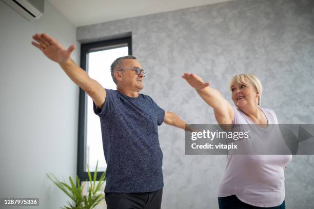 yoga at home - active lifestyle overweight stock pictures, royalty-free photos & images