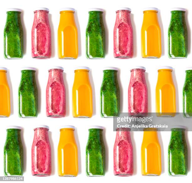 colorful fruits and berry smoothies in bottles isolated - detox stockfoto's en -beelden