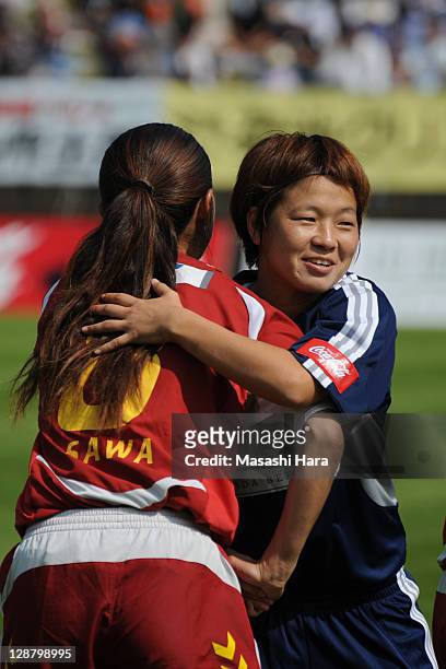 Aya Miyama of Okayama Yunogo Belle hugs Homare Sawa before the Nadeshiko League match between Okayama Yunogo Belle and INAC Kobe Leonessa at Mimasaka...