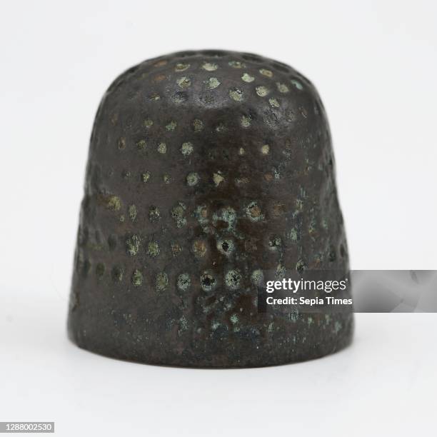 Copper molded thimble with smashed pits.