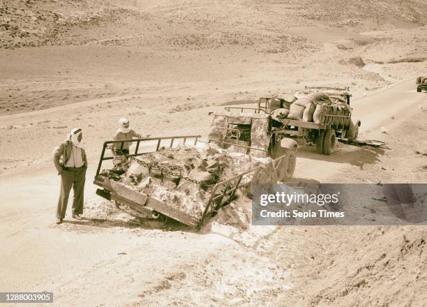 Potash lorries burned on Jericho road Two of five Potash lorries destroyed by Arab rebels on Jericho road. 1938, Israel.