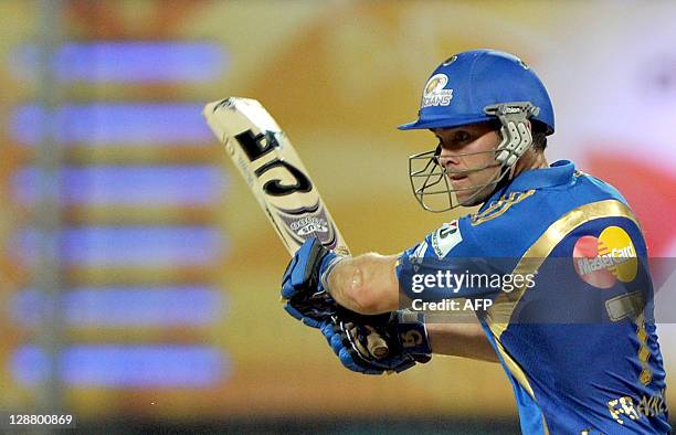 Mumbai Indians batsman James Franklin plays a shot during the Champions League Twenty20 final match between Royal Challengers Bangalore and Mumbai...